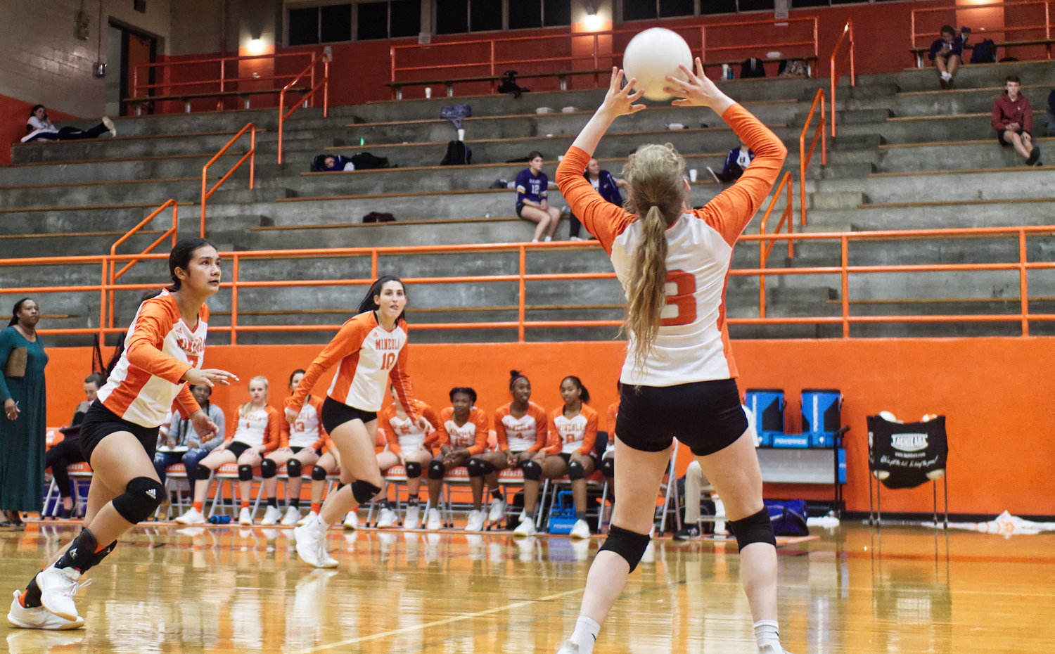 Mylee Fischer (3, right) sets the ball, and Valerie Garcia and Britney Pickle prepare to go in for the kill.